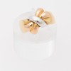 Three-tone gold Bow ring.